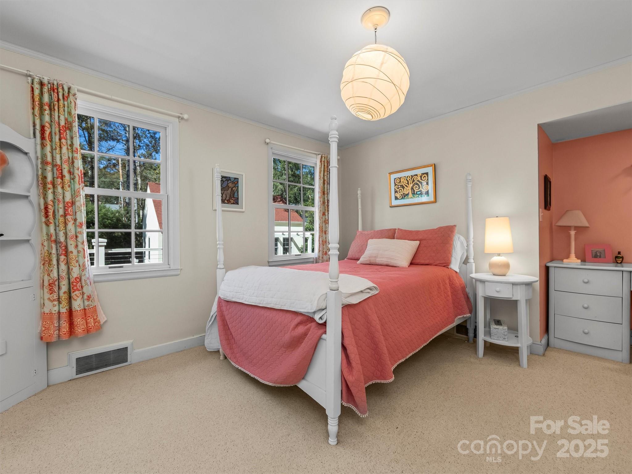 7 Park Road Asheville, NC 28803 - Photo 32 of 48 a bedroom with a bed and window