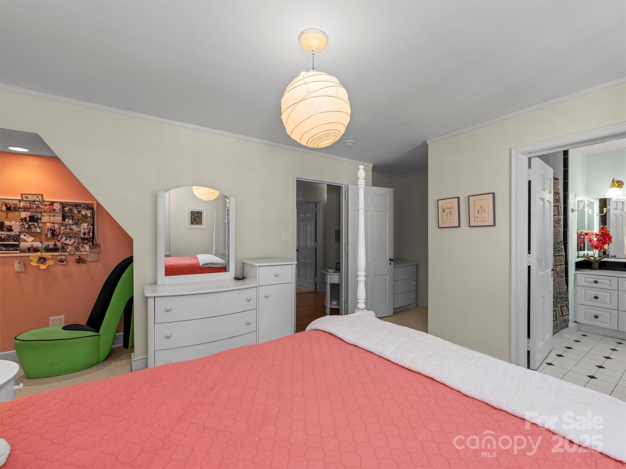 7 Park Road Asheville, NC 28803 - Photo 33 of 48 a bedroom with a bed and a mirror