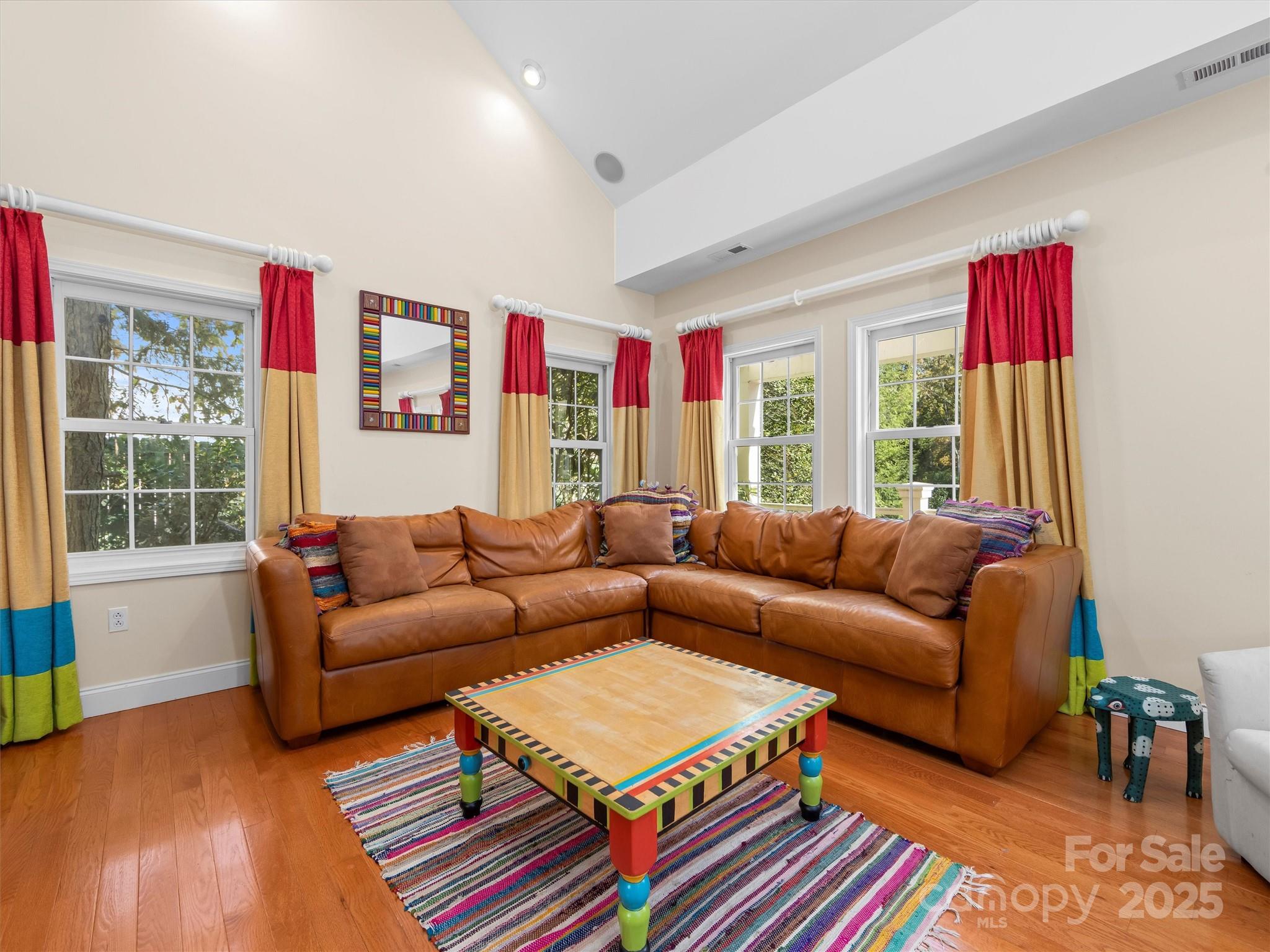 7 Park Road Asheville, NC 28803 - Photo 46 of 48 a living room with furniture a bookshelf and a window