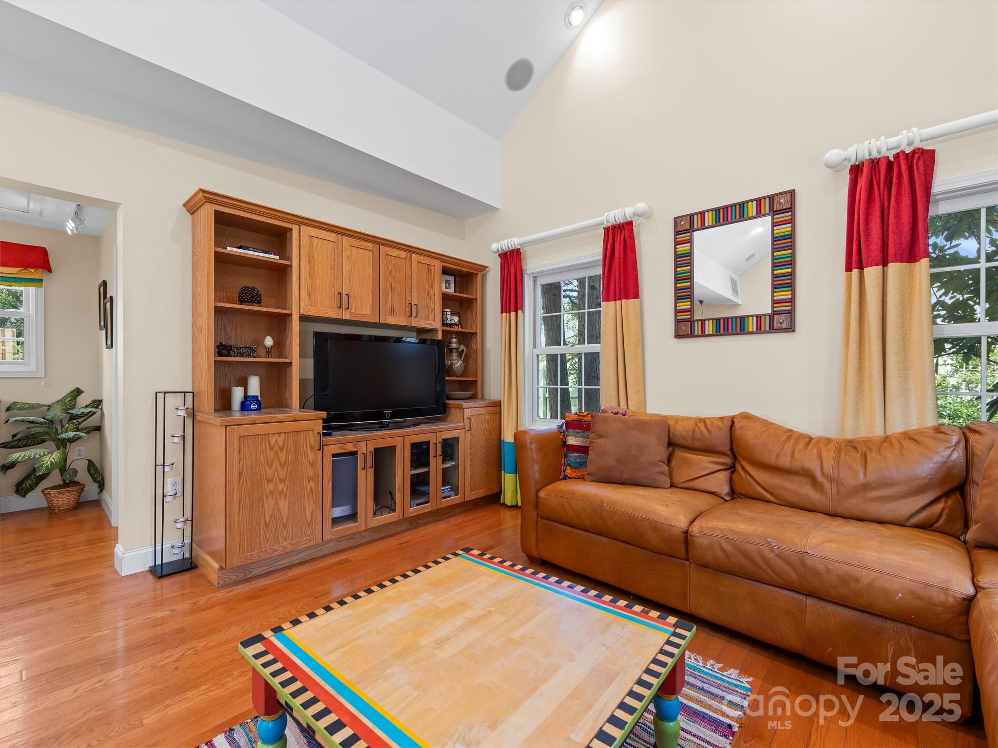 7 Park Road Asheville, NC 28803 - Photo 47 of 48 a living room with furniture and a flat screen tv