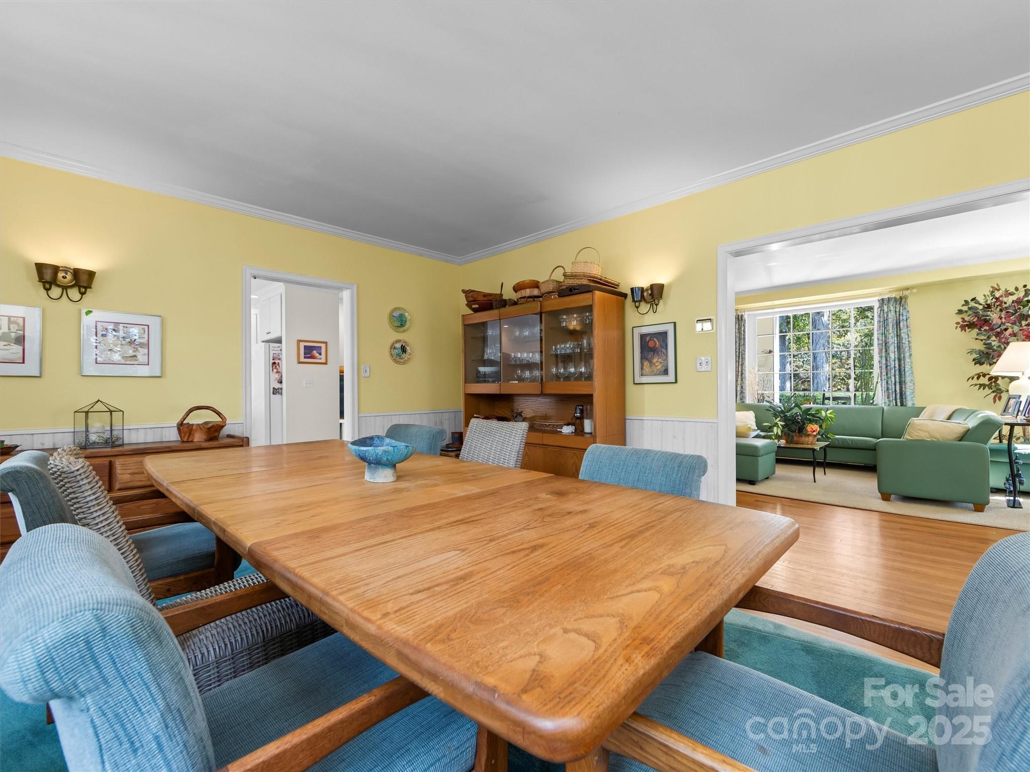 7 Park Road Asheville, NC 28803 - Photo 10 of 48 a bed room with a bed furniture and a flat screen tv
