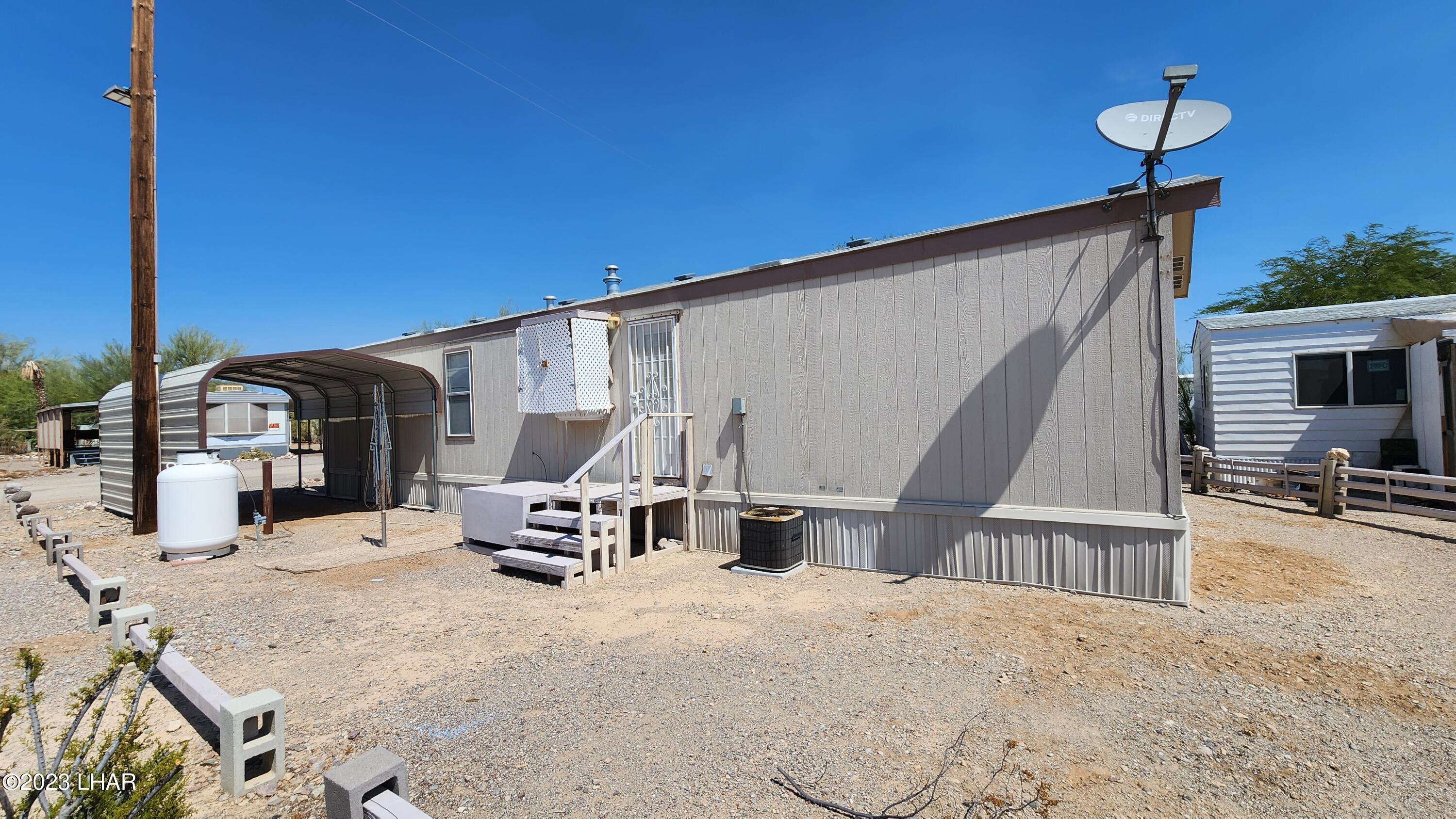 1240 Acacia Road, Unit 155 Quartzsite, AZ 85346 - Photo 17 of 21 Back door & 2nd carport