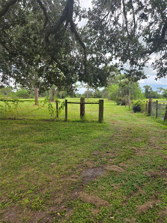 885 Lake Marian Road Kenansville, FL 34739 - Photo 4 of 11 a view of a park with large trees