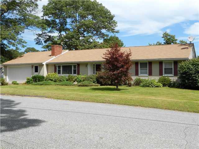16 Sawmill Hill Road Killingly, CT 06239 - Photo 1 of 1 a front view of a house with a yard and trees