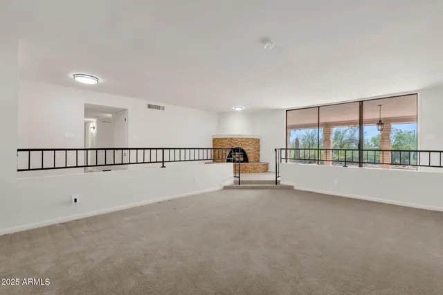 a kitchen with stainless steel appliances a refrigerator sink and stove