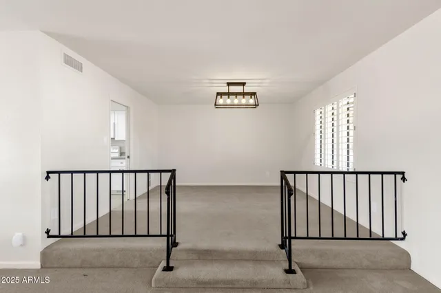 a kitchen with granite countertop a sink and cabinets