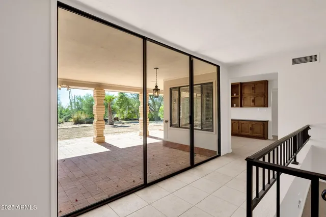 a bedroom with bed and window