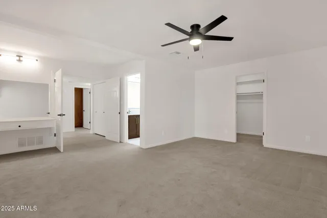 a view of an empty room with glass door