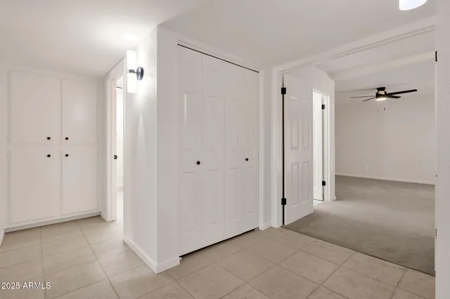 a view of a room with wooden floor and iron stairs