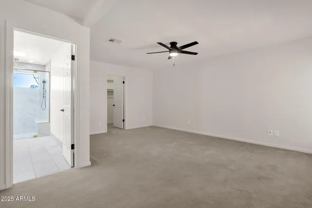 a view of a yard with plants and trees