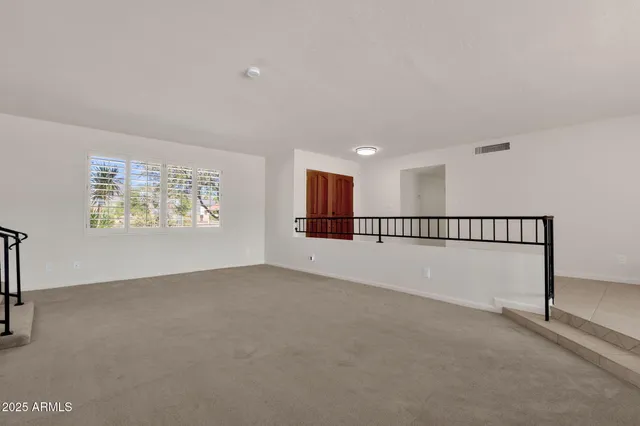 a view of livingroom with furniture and windows