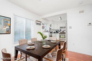 70 Ilyssa Way Staten Island, NY 10312 - Photo 16 of 39 a view of a dining room with furniture and wooden floor