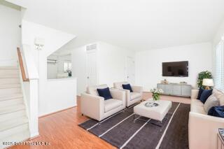 70 Ilyssa Way Staten Island, NY 10312 - Photo 20 of 39 a living room with furniture and a flat screen tv