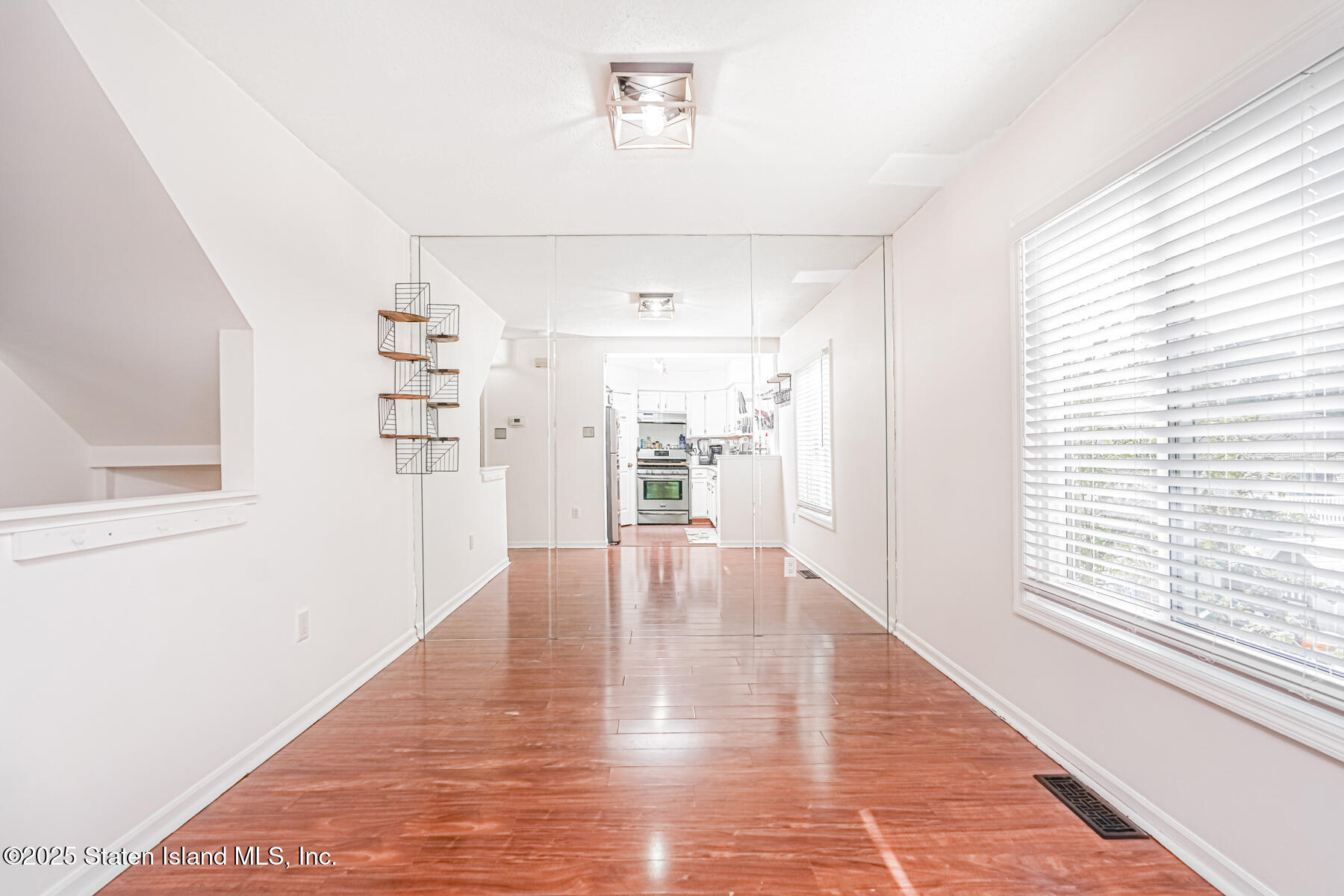 70 Ilyssa Way Staten Island, NY 10312 - Photo 22 of 39 a view of empty room with wooden floor and fan