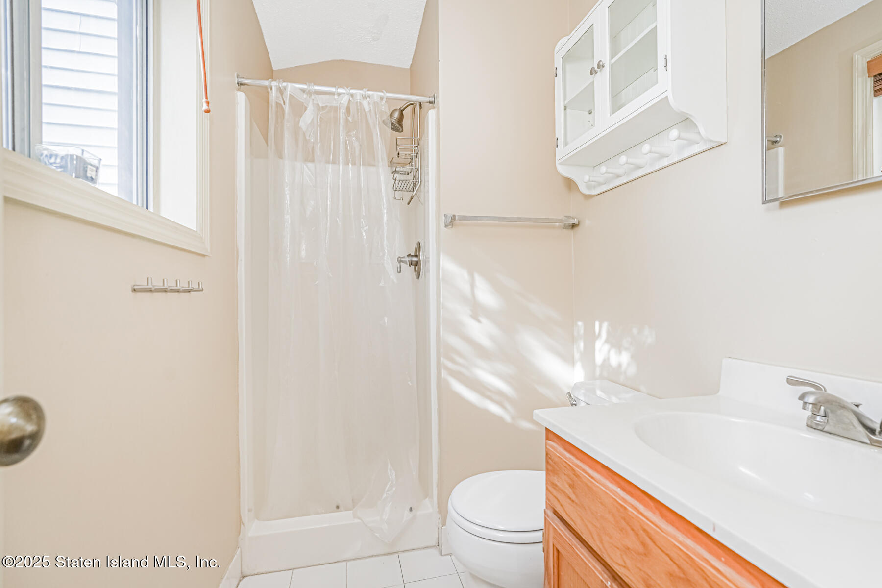 70 Ilyssa Way Staten Island, NY 10312 - Photo 27 of 39 a bathroom with a sink a toilet and shower