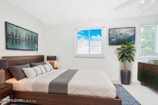 70 Ilyssa Way Staten Island, NY 10312 - Photo 38 of 39 a bedroom with a bed and a potted plant