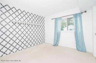 70 Ilyssa Way Staten Island, NY 10312 - Photo 4 of 39 a view of a black gate