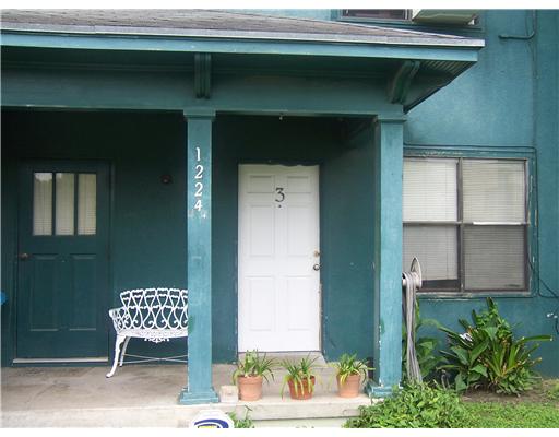1224 2nd Street, Unit 3 Corpus Christi, TX 78404 - Photo 2 of 9 a brick house with a outdoor space