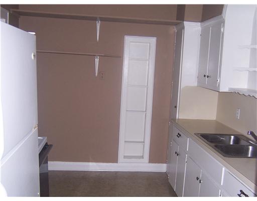 1224 2nd Street, Unit 3 Corpus Christi, TX 78404 - Photo 6 of 9 a kitchen with a sink and cabinets