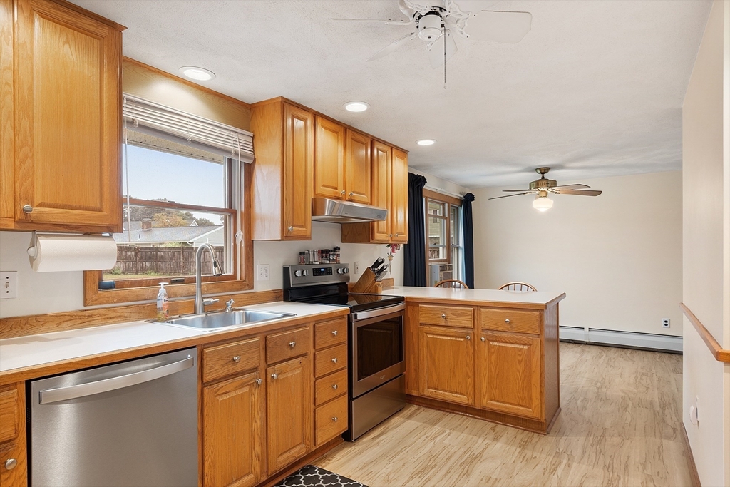 6 Colgate Street Danvers, MA 01923 - Photo 12 of 38 a kitchen a sink a window and cabinets