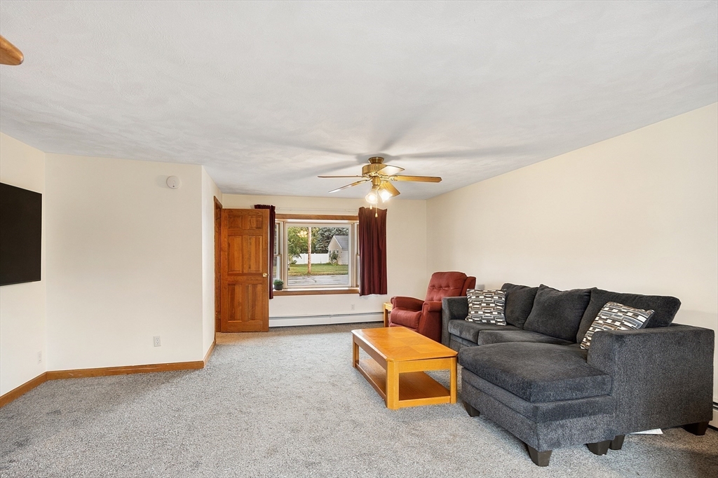 6 Colgate Street Danvers, MA 01923 - Photo 16 of 38 a living room with furniture a ceiling fan and a window