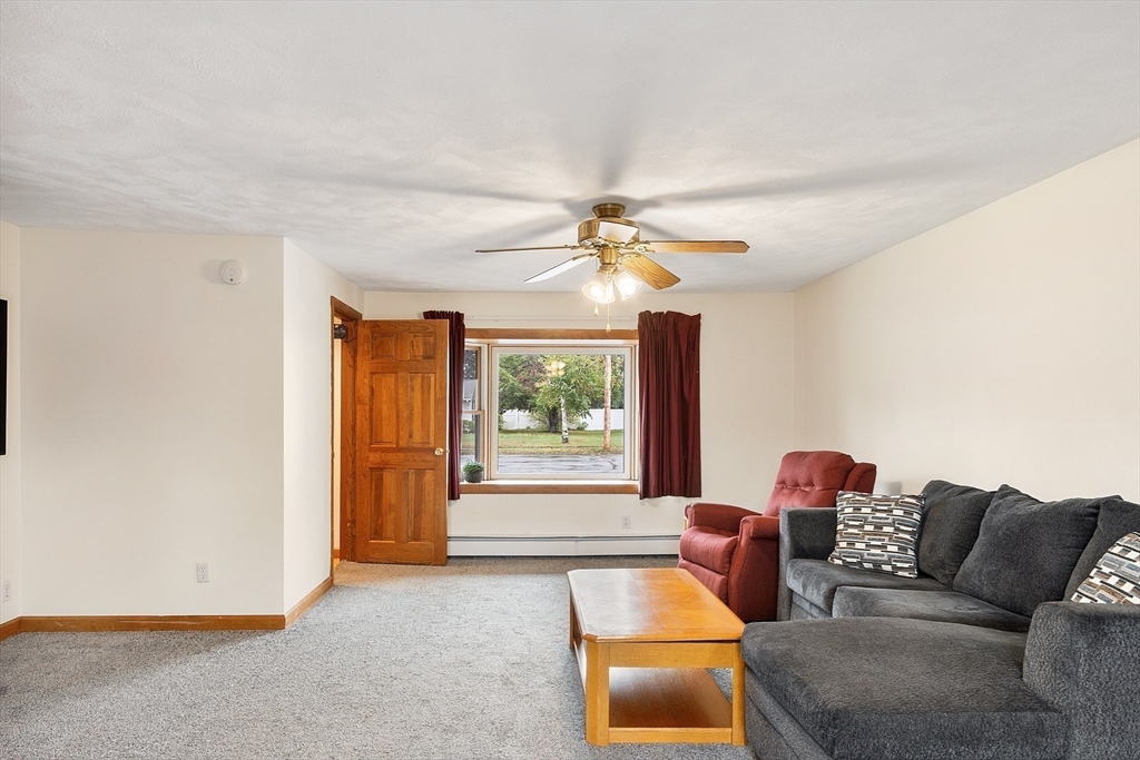 6 Colgate Street Danvers, MA 01923 - Photo 17 of 38 a living room with furniture and a window