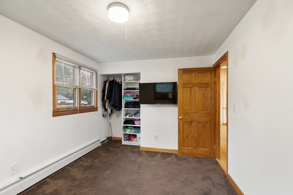 6 Colgate Street Danvers, MA 01923 - Photo 26 of 38 a view of a livingroom with a furniture and a window