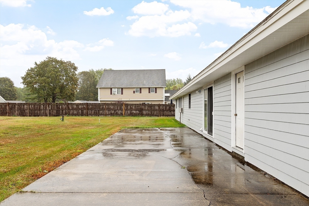 6 Colgate Street Danvers, MA 01923 - Photo 30 of 38 a view of swimming pool with outdoor seating and house in the background