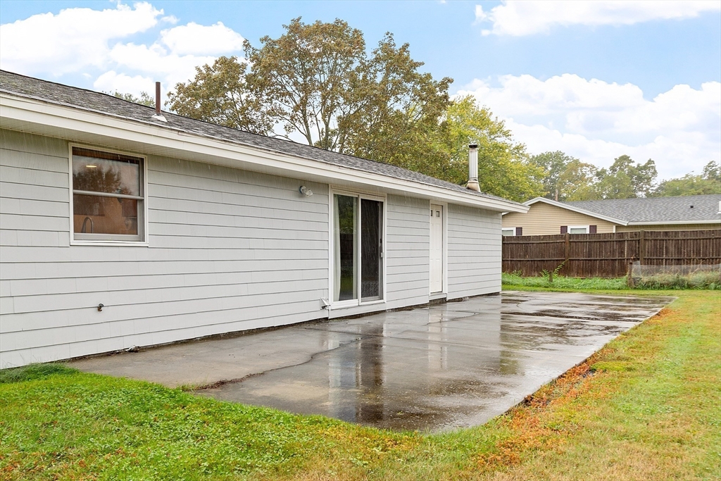 6 Colgate Street Danvers, MA 01923 - Photo 31 of 38 a view of a backyard with a patio