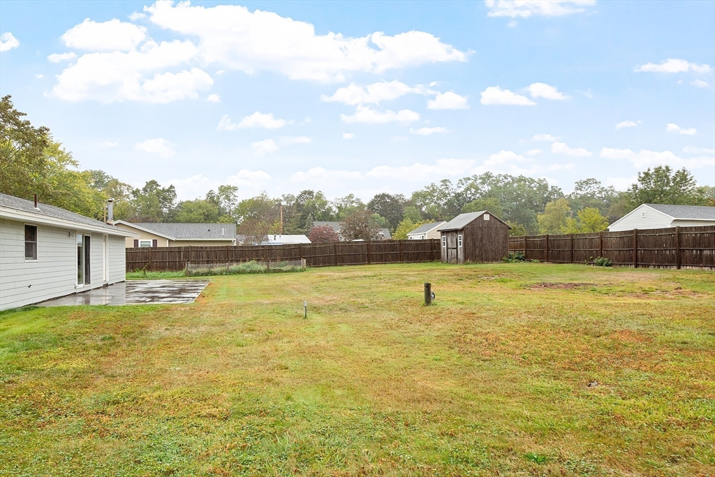 6 Colgate Street Danvers, MA 01923 - Photo 33 of 38 a view of a swimming pool with a yard