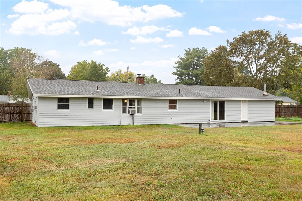 6 Colgate Street Danvers, MA 01923 - Photo 35 of 38 a view of a house with a yard and a large tree