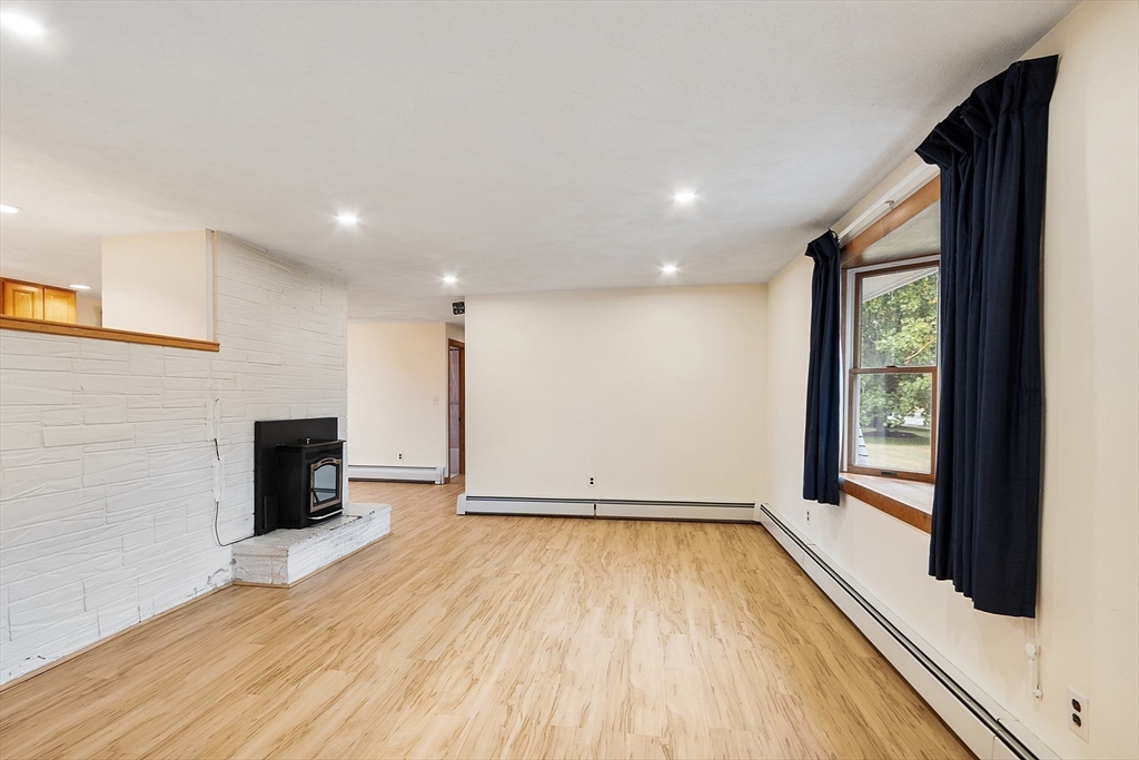 6 Colgate Street Danvers, MA 01923 - Photo 6 of 38 wooden floor in an empty room with a window