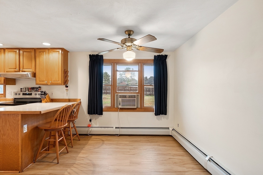6 Colgate Street Danvers, MA 01923 - Photo 10 of 38 a kitchen with a stove a sink and a refrigerator