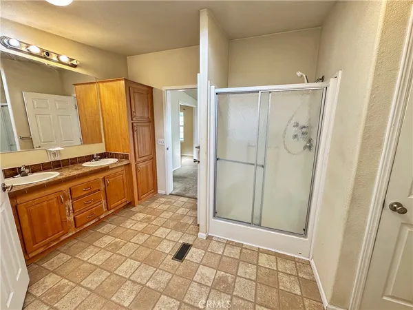 a kitchen with stainless steel appliances granite countertop a refrigerator and a stove