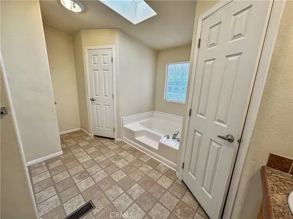 a bathroom with a sink a mirror and a shower