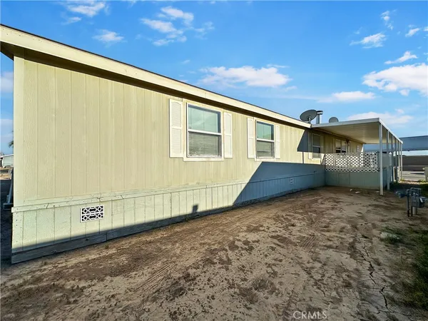 a backyard of a house with garage