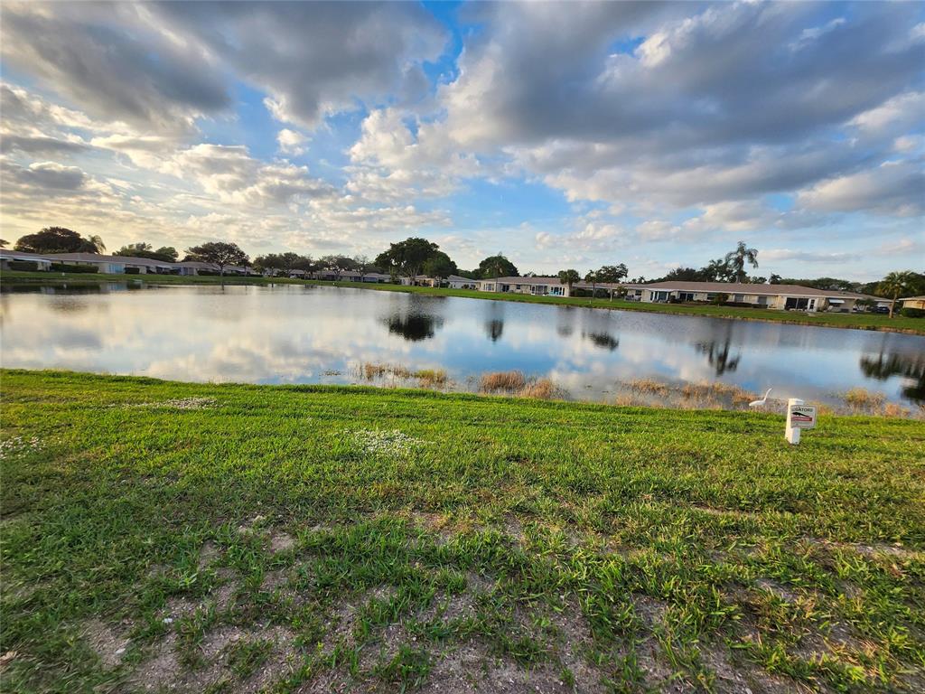 8777 Warwick Drive, Unit 265 Boca Raton, FL 33433 - Photo 11 of 31 a view of a lake from a yard