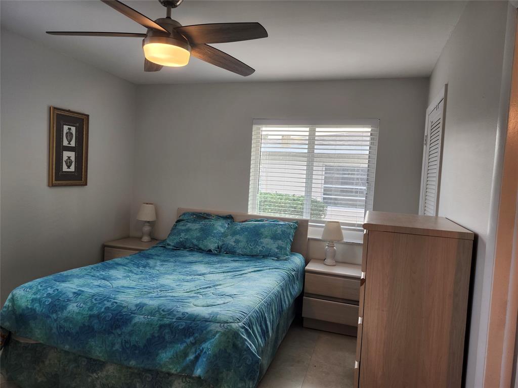 8777 Warwick Drive, Unit 265 Boca Raton, FL 33433 - Photo 20 of 31 a bedroom with a bed and a window