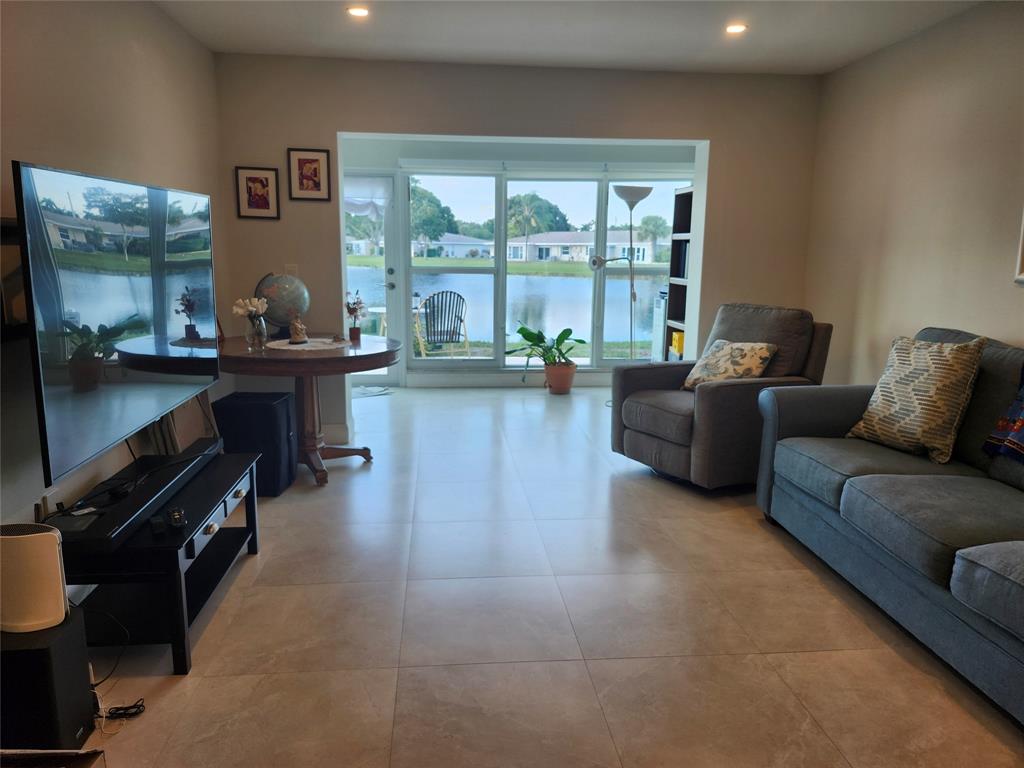 8777 Warwick Drive, Unit 265 Boca Raton, FL 33433 - Photo 2 of 31 a living room with furniture and a large window