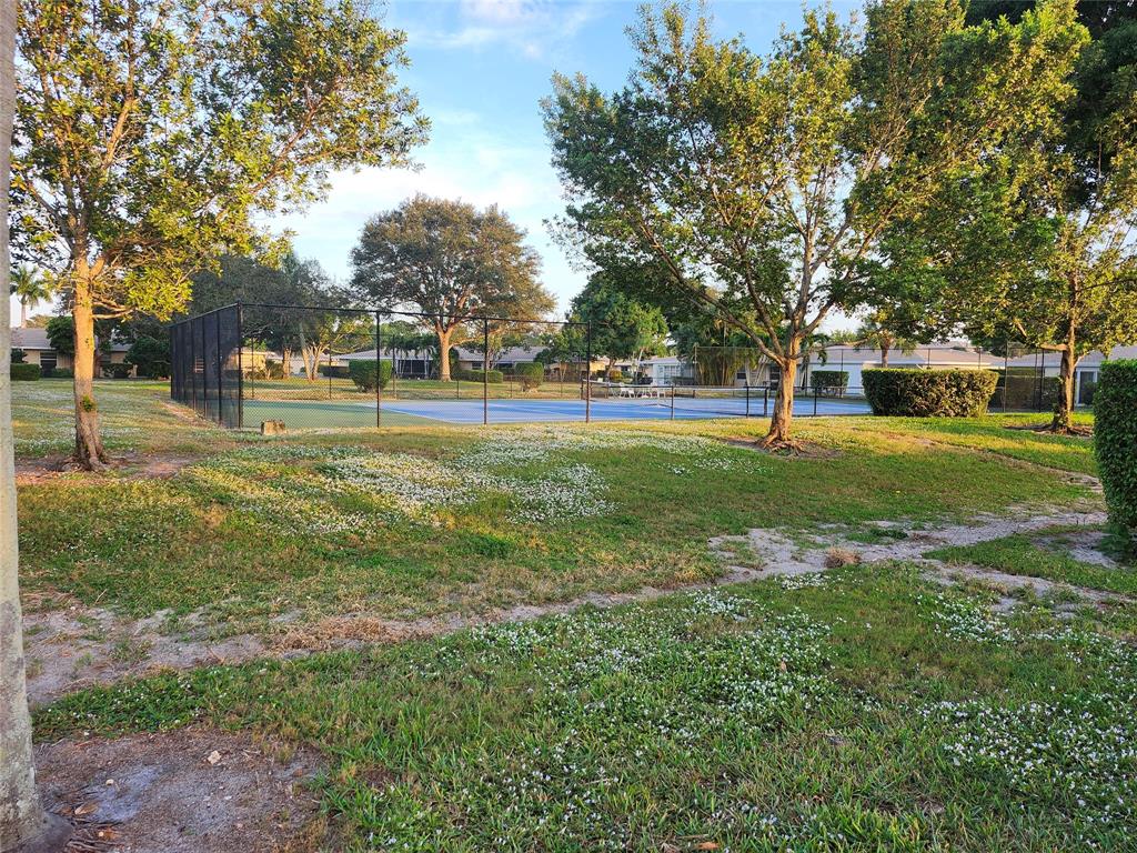 8777 Warwick Drive, Unit 265 Boca Raton, FL 33433 - Photo 28 of 31 a view of a park with large trees