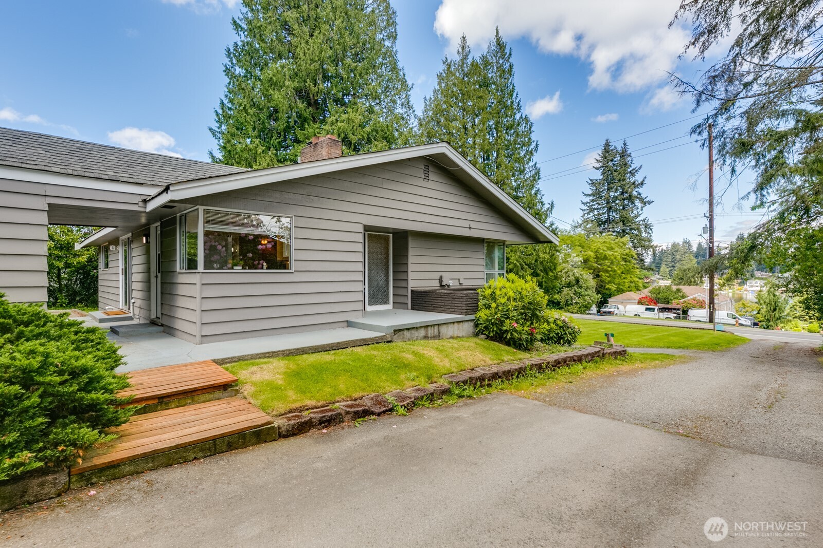 3822 Shelby Road Lynnwood, WA 98087 - Photo 36 of 40 a view of a house with pool and chairs