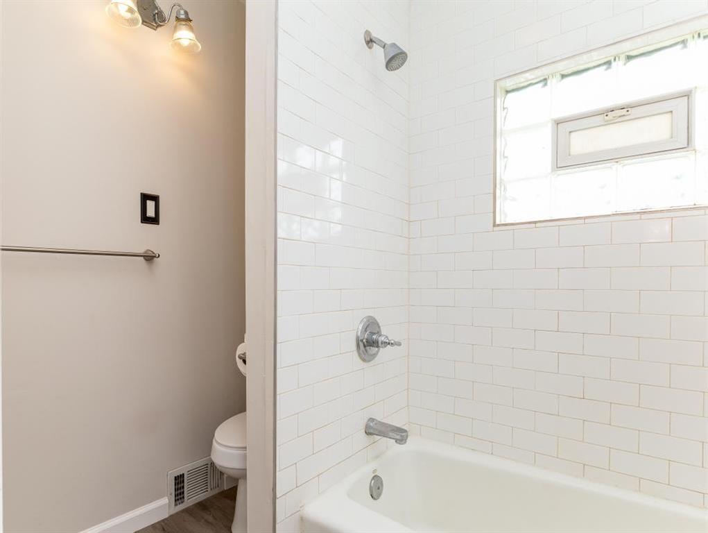 448 Park Street Rochester, PA 15074 - Photo 19 of 29 a bathroom with a bathtub and a shower