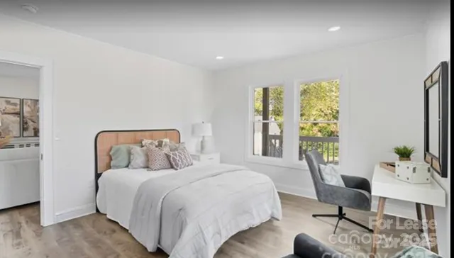 a bed room with a bed and a chair