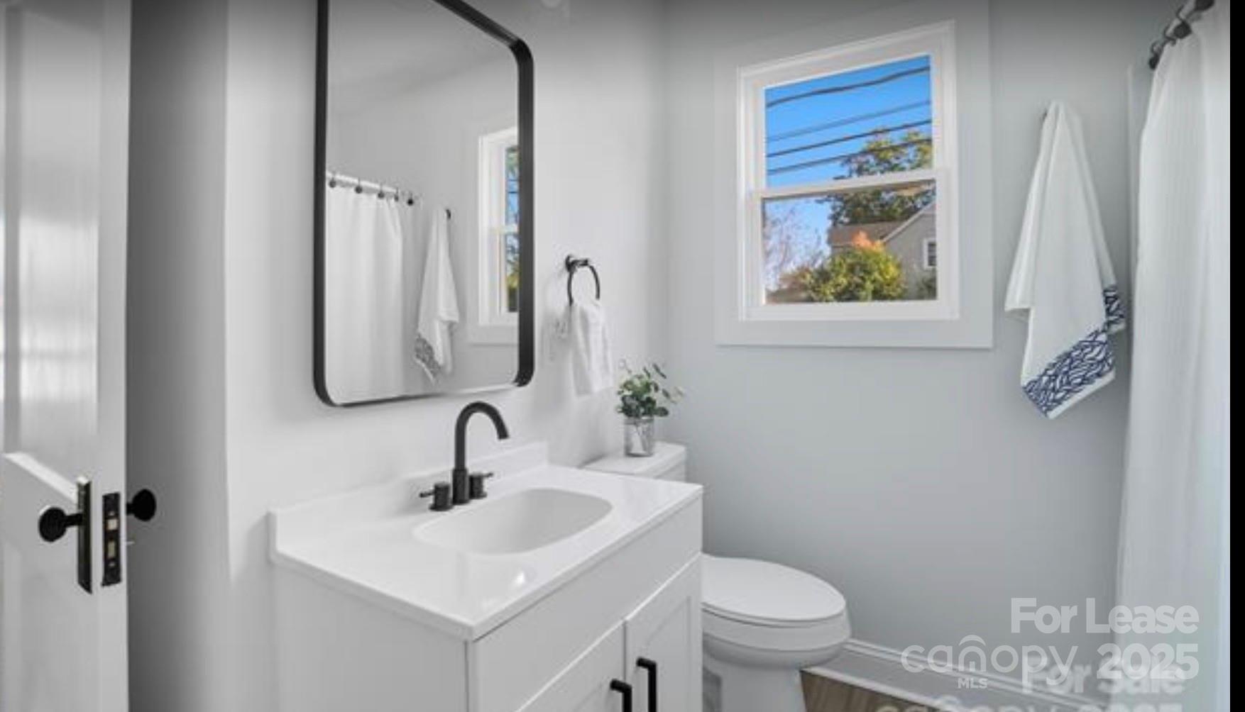 64 Brumley Avenue Northeast Concord, NC 28025 - Photo 9 of 19 a bathroom with a sink and a toilet