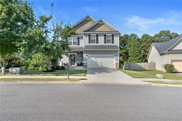 a house with trees in the background