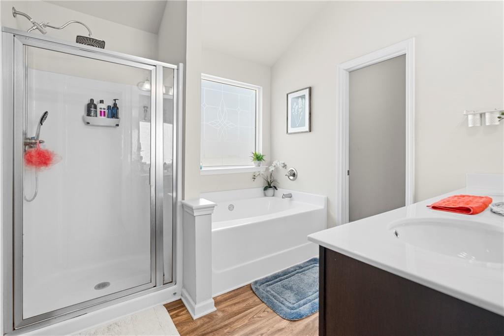 511 Autumn Echo Canton, GA 30114 - Photo 20 of 45 a bathroom with a bathtub sink and toilet