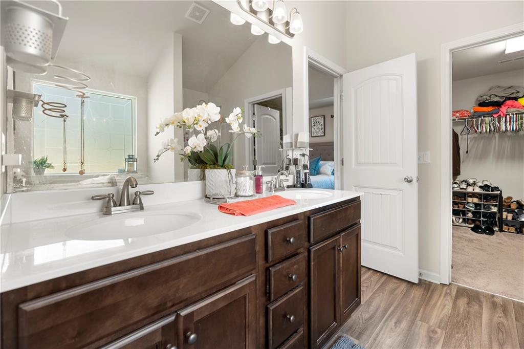 511 Autumn Echo Canton, GA 30114 - Photo 22 of 45 a bathroom with a sink double vanity and a mirror