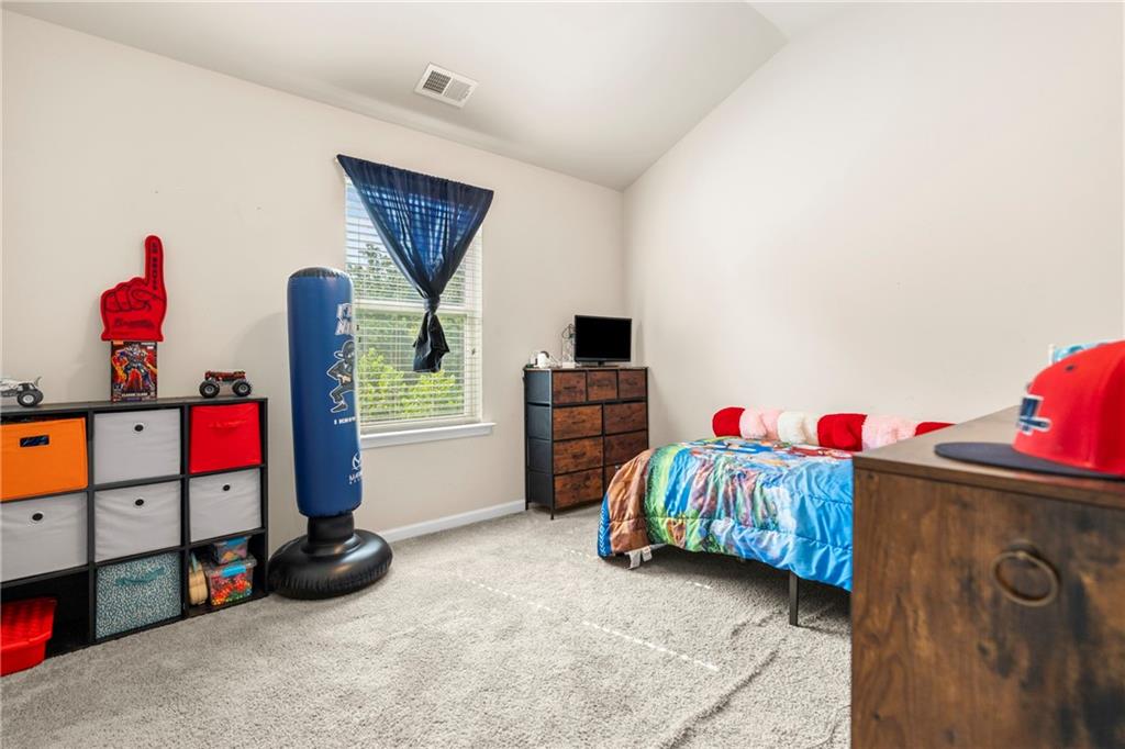 511 Autumn Echo Canton, GA 30114 - Photo 23 of 45 a bedroom with a bed and a tv