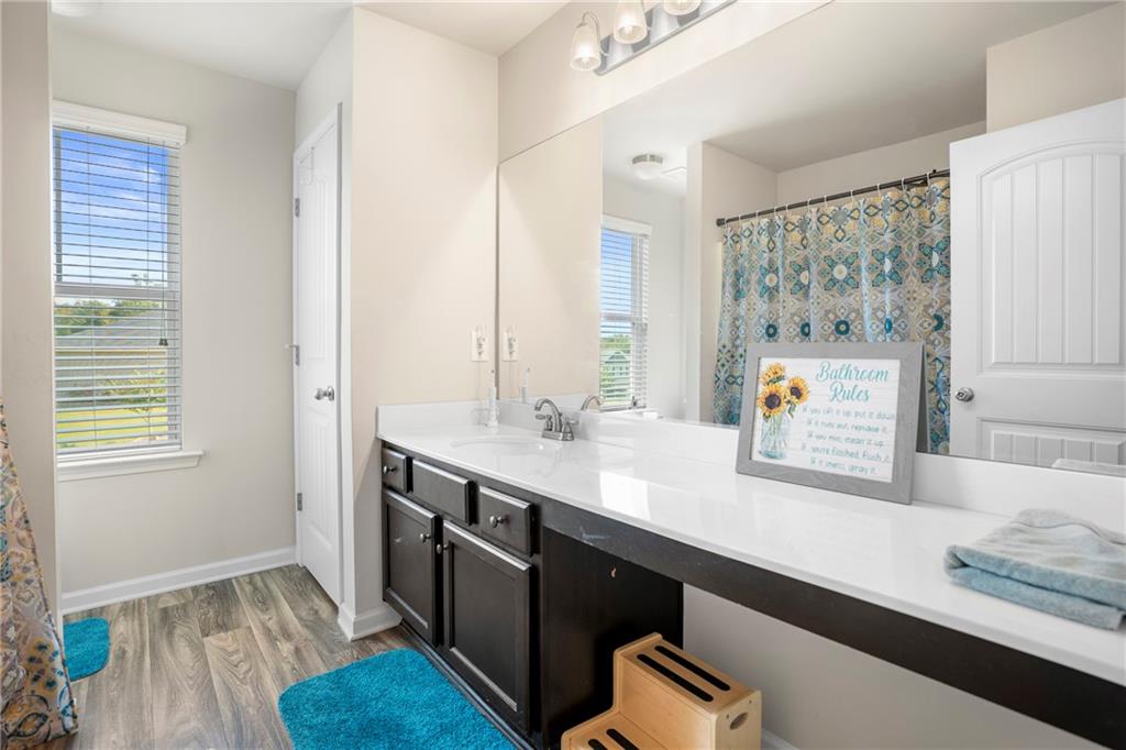 511 Autumn Echo Canton, GA 30114 - Photo 26 of 45 a kitchen with a sink and a window