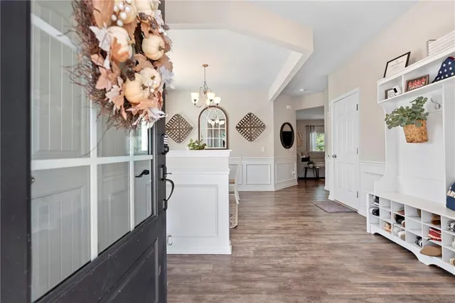 a view of an entryway with wooden floor